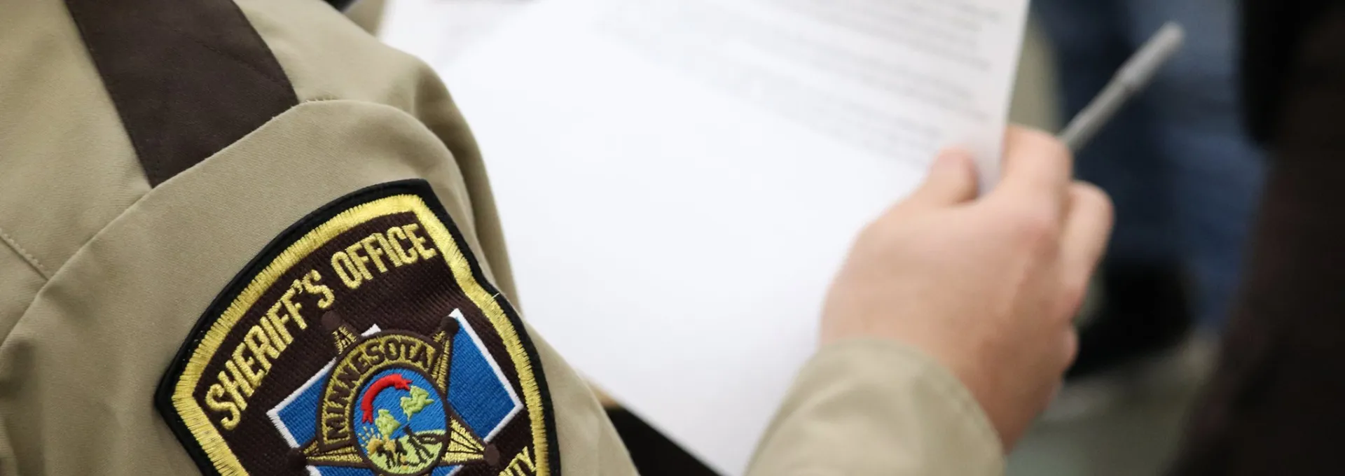 Sheriff's Office Deputy with Pen and Paper