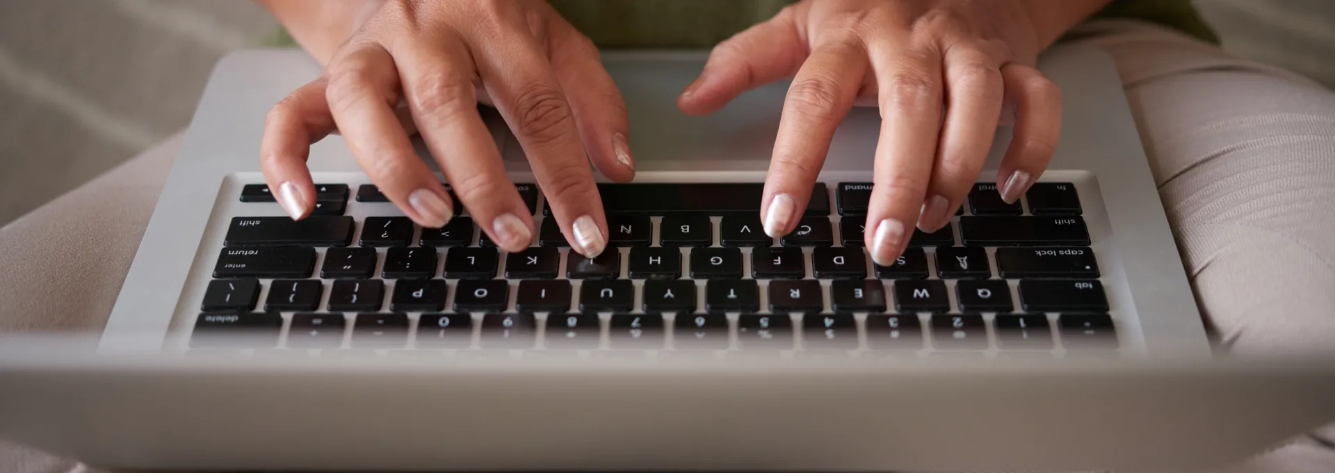 Person typing on keyboard