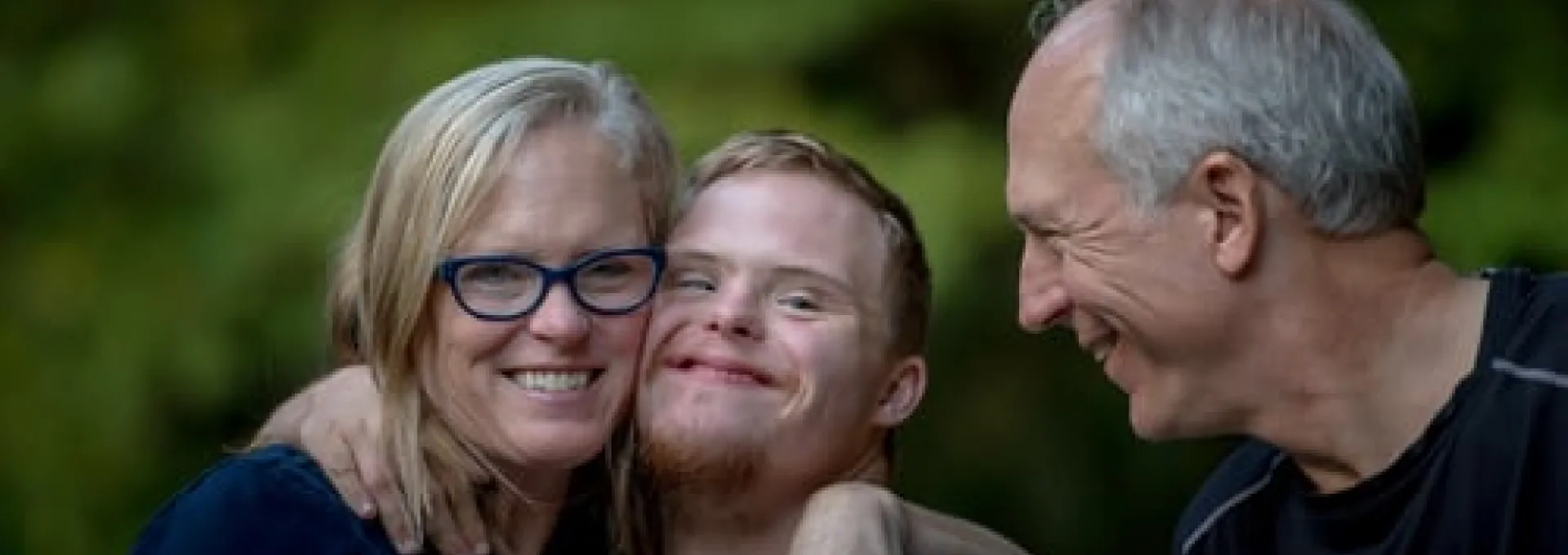 Mother, Father and Son hugging