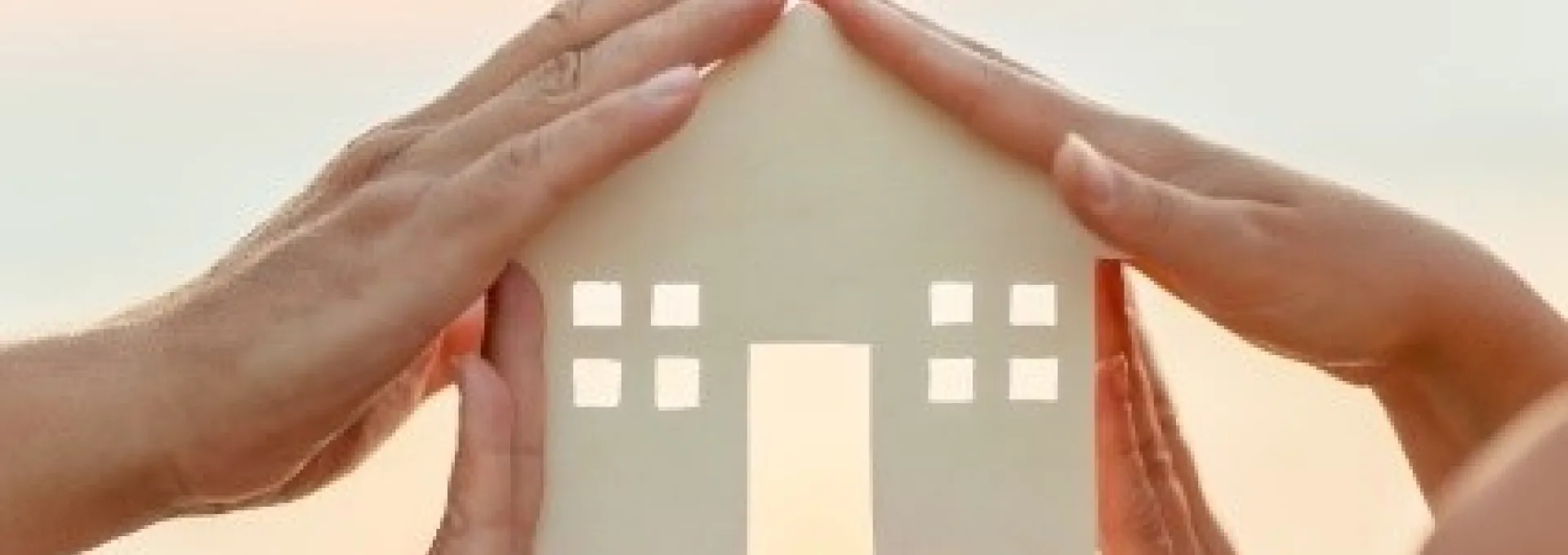 Hands around house cutout