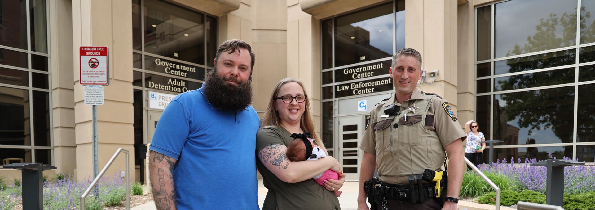 Deputy Luke Leichtnam poses with family who he helped deliver baby