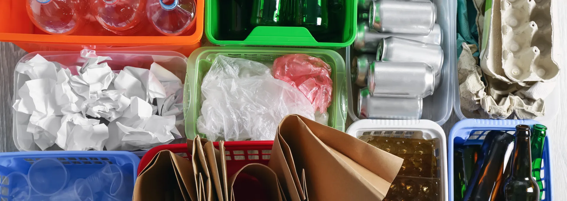 Different recyclable materials separated into different containers