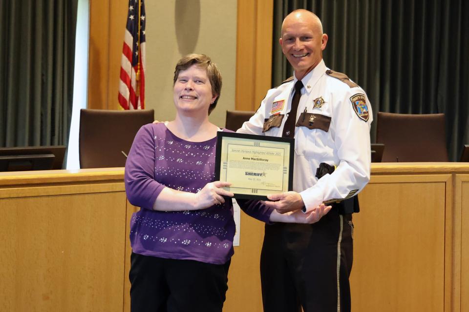 Sheriff Torgerson presents Special Olympics recognition certificate to local athlete Anne MacGillivray