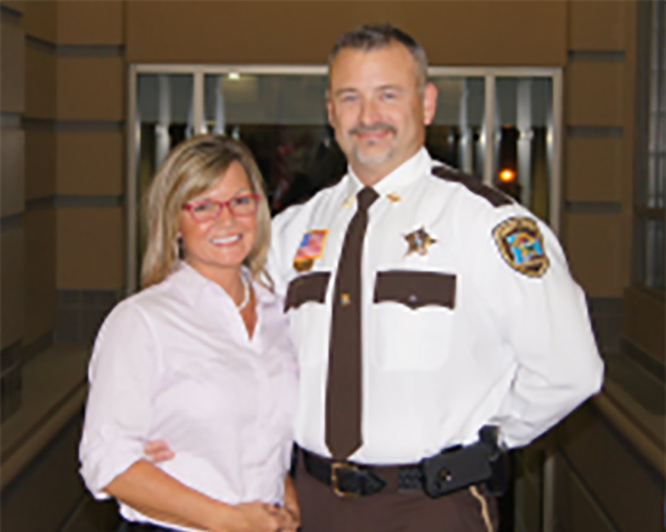 Captain Behrns in uniform with his wife Holly