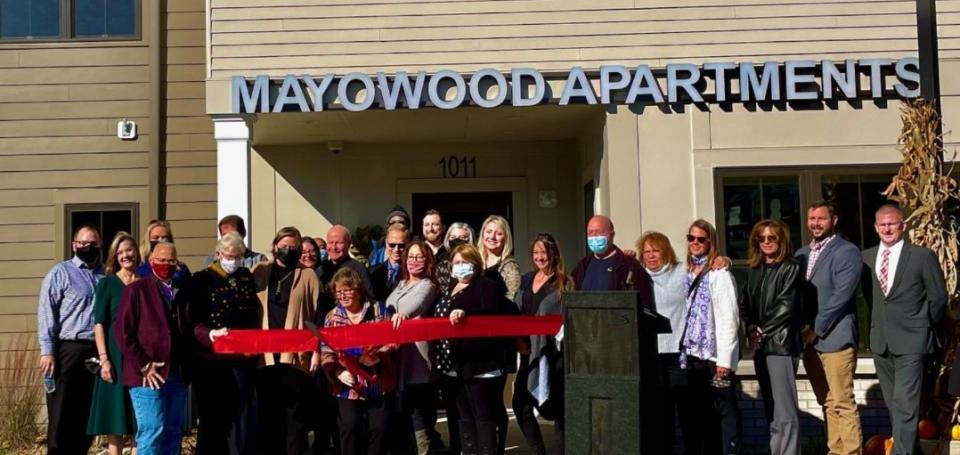 People gather for the grand opening of Mayowood Apartments in Rochester, MN.