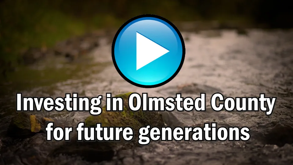 Play button for Olmsted County's American Rescue Plan Act video. Text on screen reads Investing in Olmsted County for future generations.