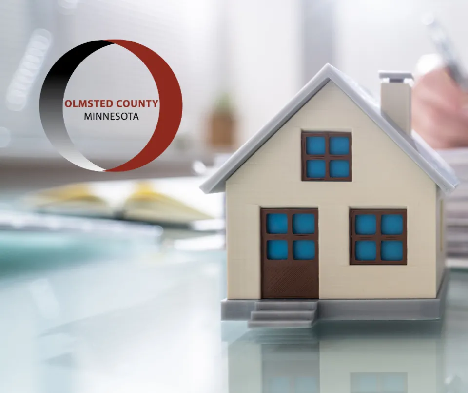 Model of a house with the Olmsted County logo in the upper left corner of the picture.