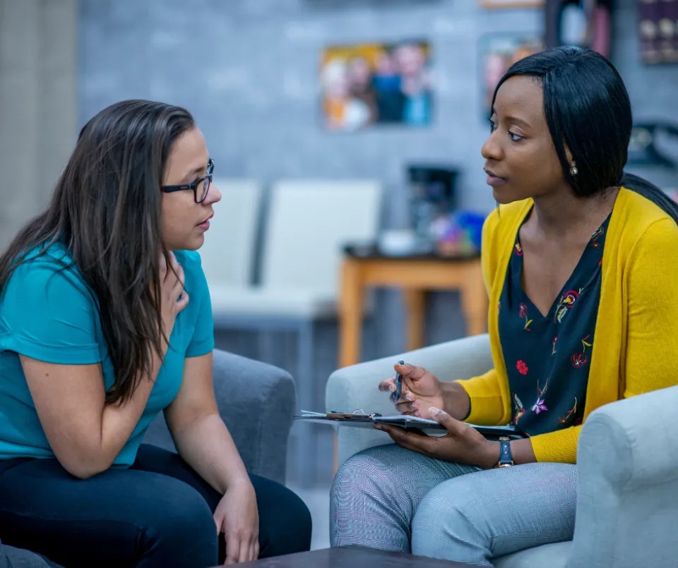 Social worker meeting with a client