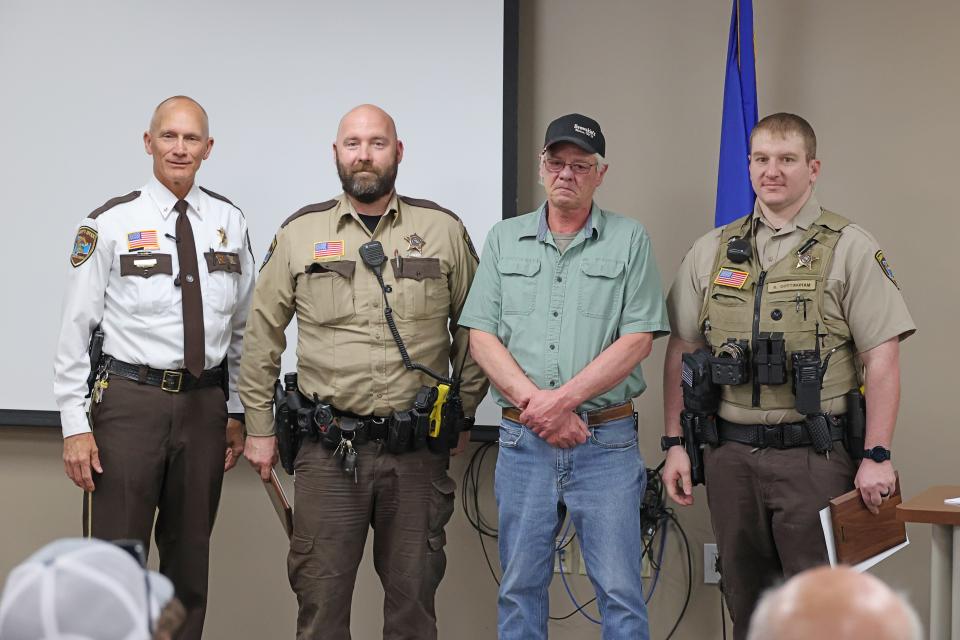 Sheriff Torgerson stands with deputies who receive life saving award