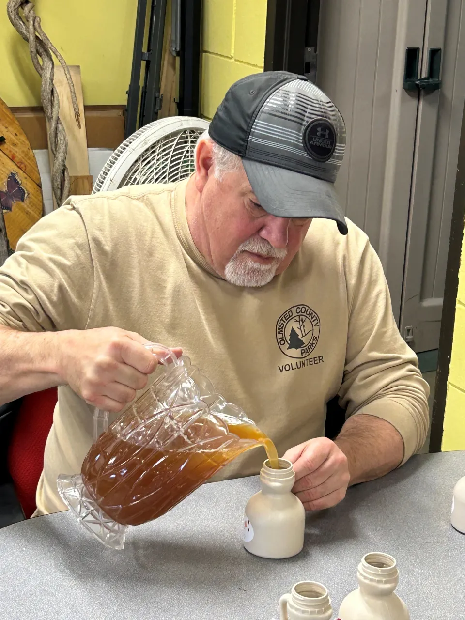 Pouring syrup into containers