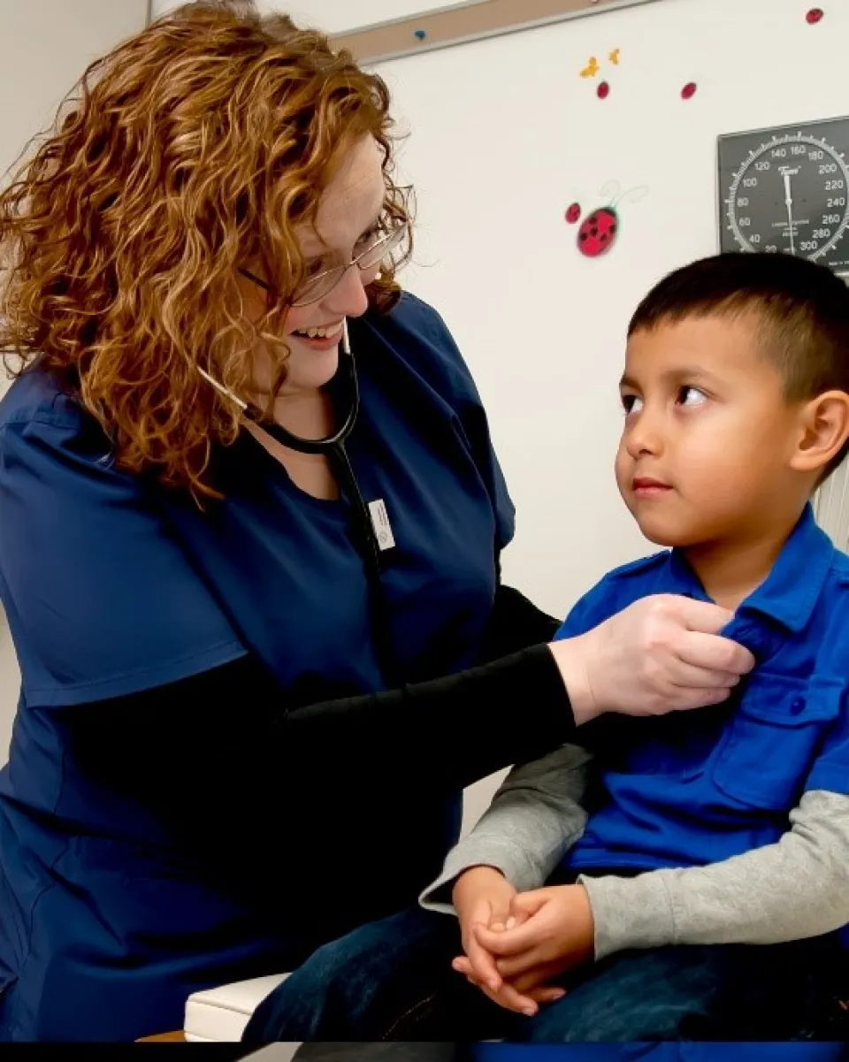 a nurse at an appointment with a child