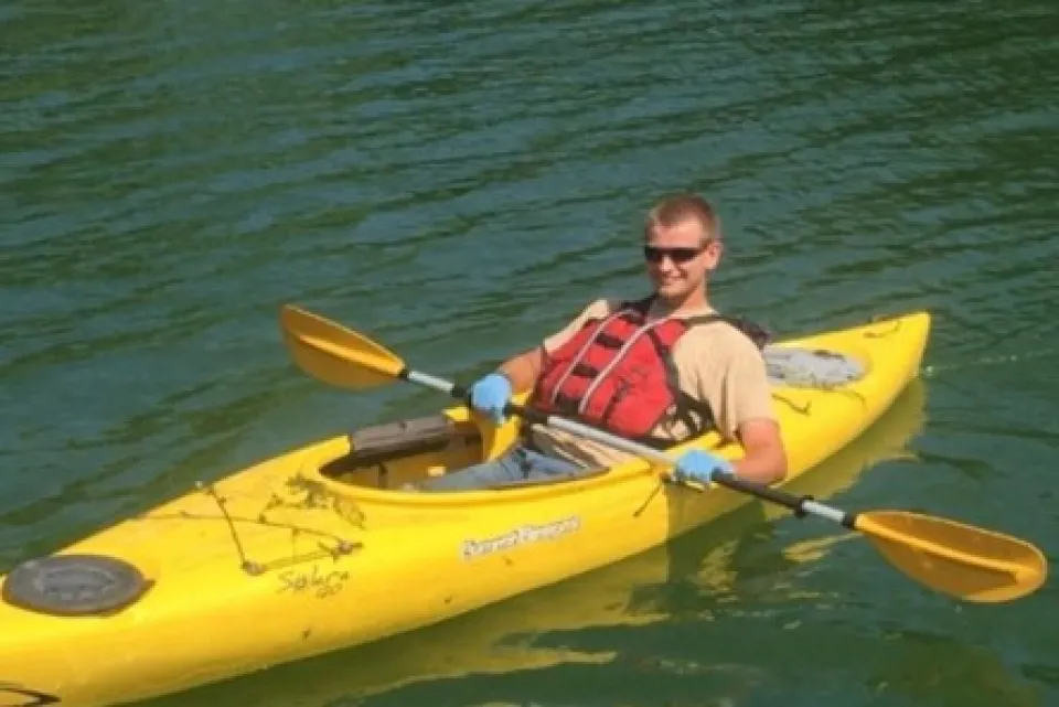 a man in a kayak on the water