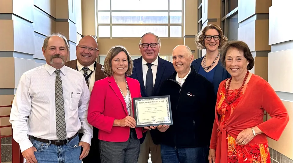 Board of Commissioners with achievement award