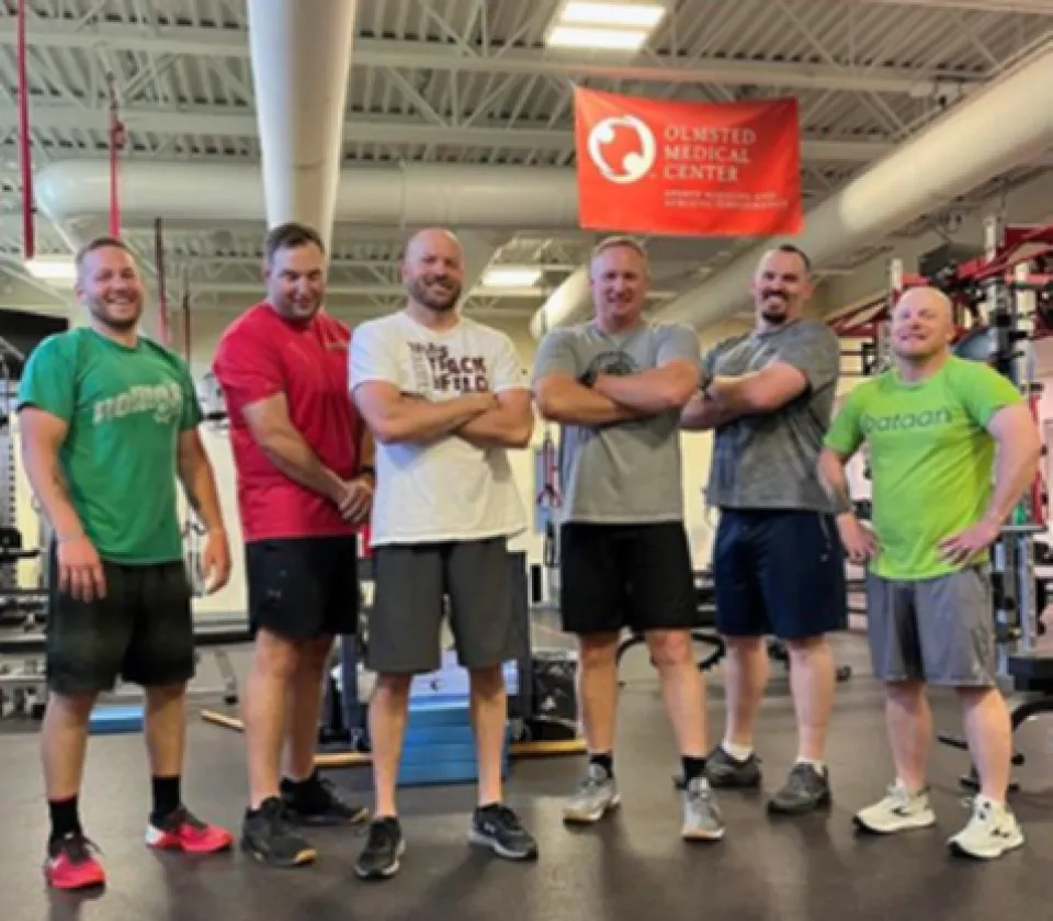 Group photo of Olmsted County Sheriff's Office staff following a workout