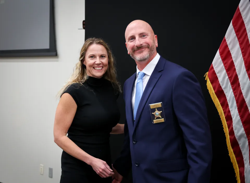 After members of our office received certificates of appointment or promotion, a family member or friend pinned their badge onto their uniform.