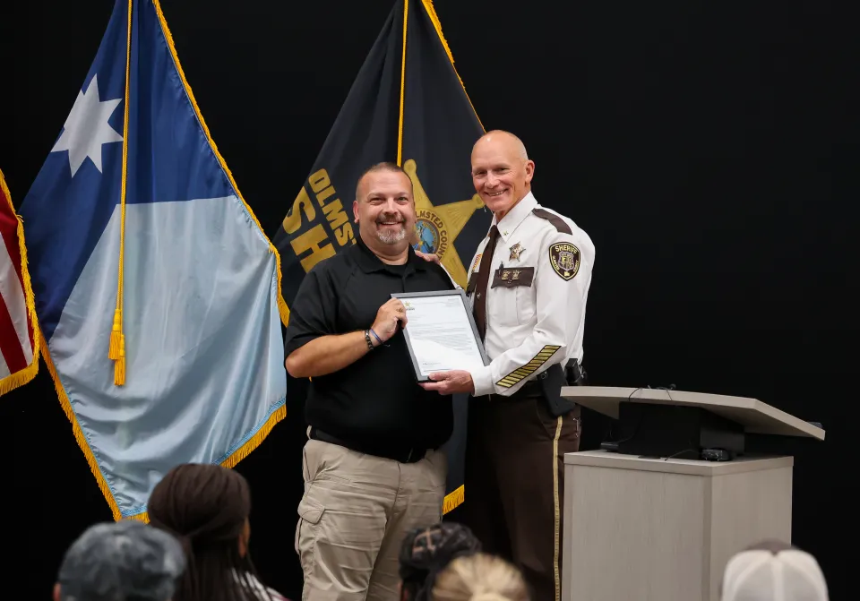 Brent Weber with Sheriff Torgerson after receiving her Letter of Recognition