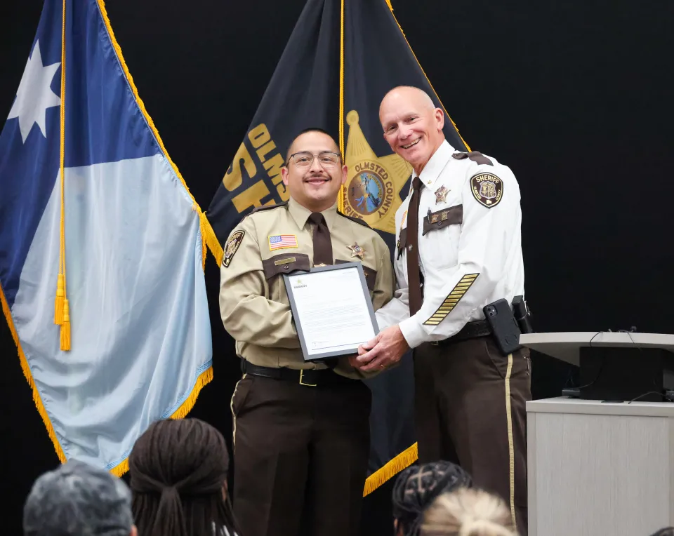 Mario Muro with Sheriff Torgerson after receiving her Letter of Recognition