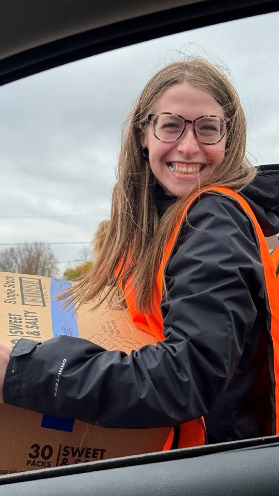 Olmsted County staff member at food distribution 