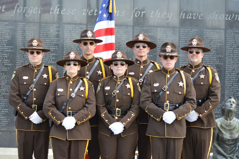 Sheriff's Office Honor Guard standing after a memorial program.