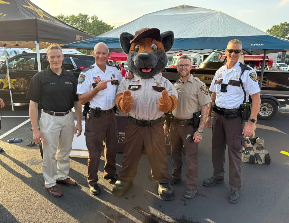 Members of the sheriff's office pose for a photo at a Safe City Nights event
