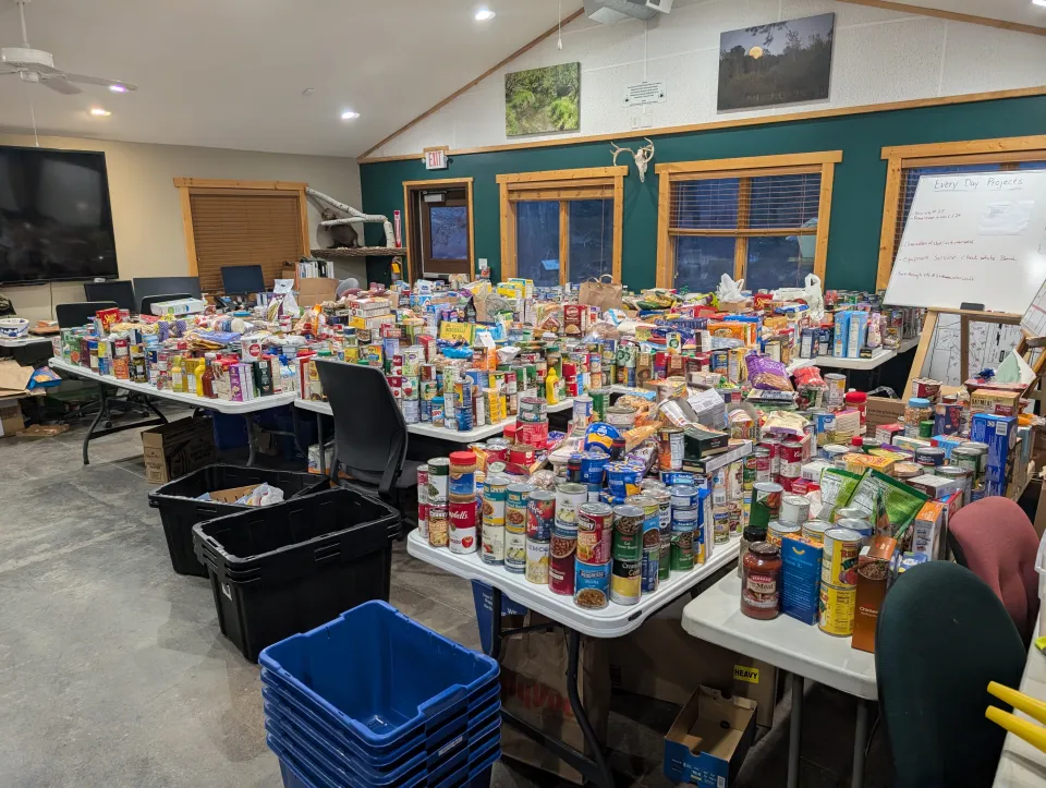 a large room filled with food donations that were collected during the light festival 