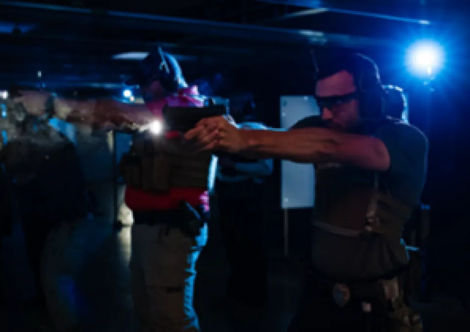 Law enforcement students practicing on a gun range.