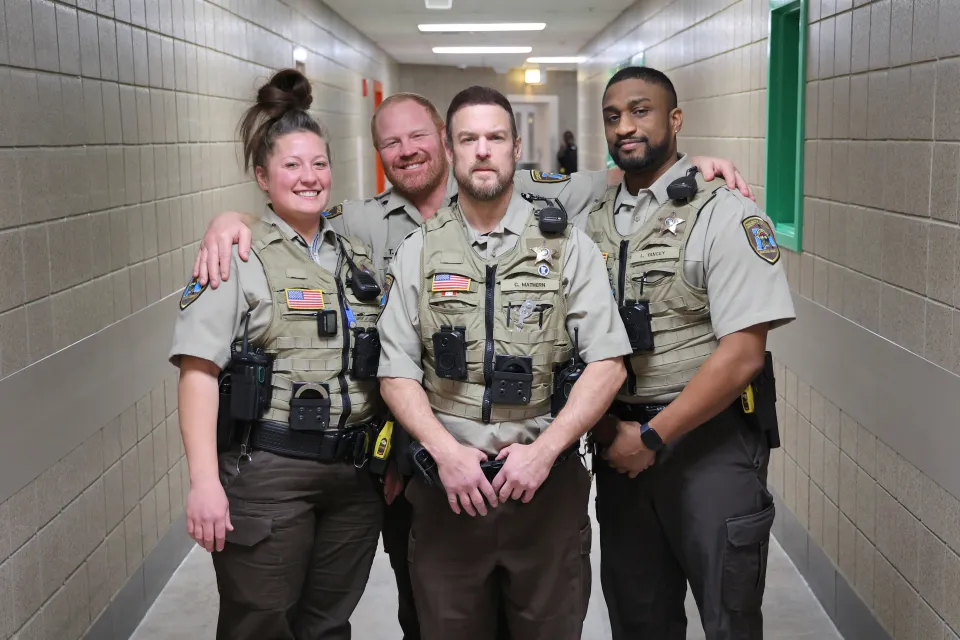 Members of the Sheriff's Office in the halls of the detention center