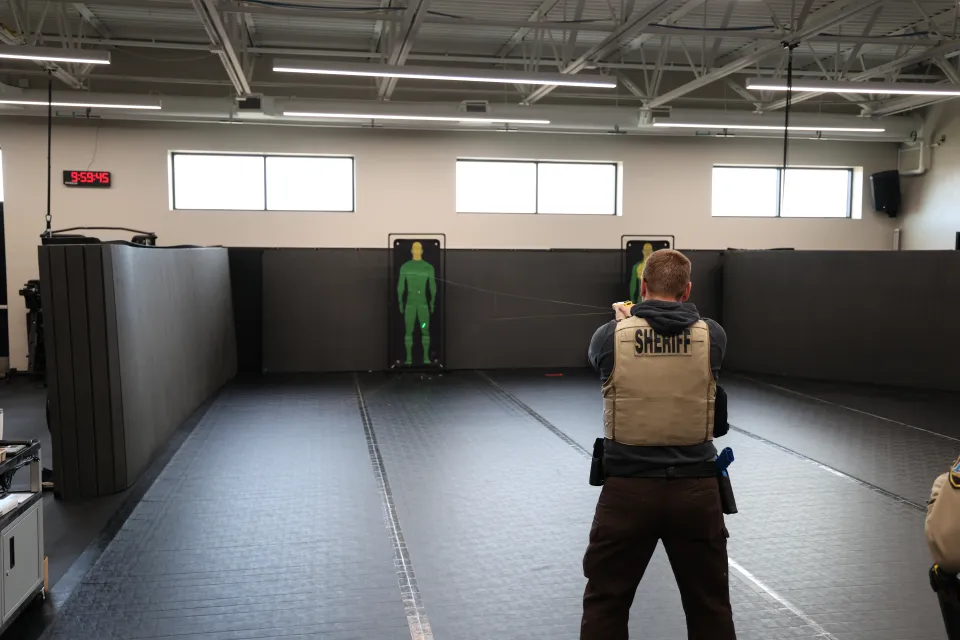 Member of the Sheriff's Office training with a taser and target