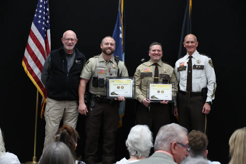Sheriff's Office members receive certificates and challenge coins for their impressive efforts promoting traffic safety on Olmsted County roads