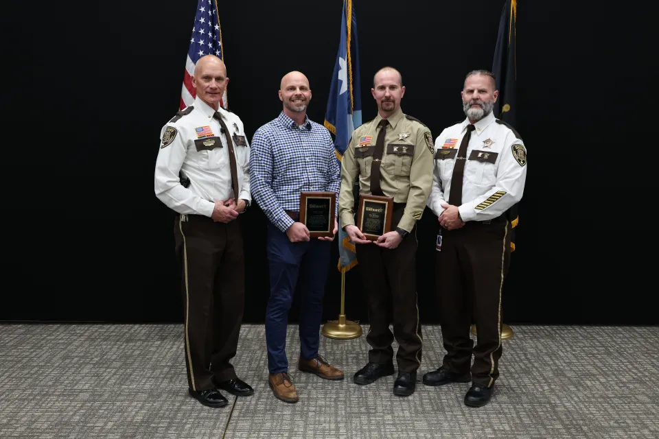 Members of the sheriff's office and community member receive life saving awards