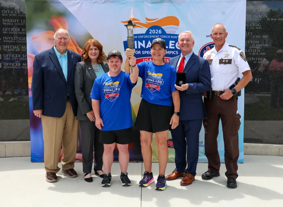 Sheriff Torgerson stands with others for a group photo at the Flame of Hope ceremony in Rochester, Minnesota.