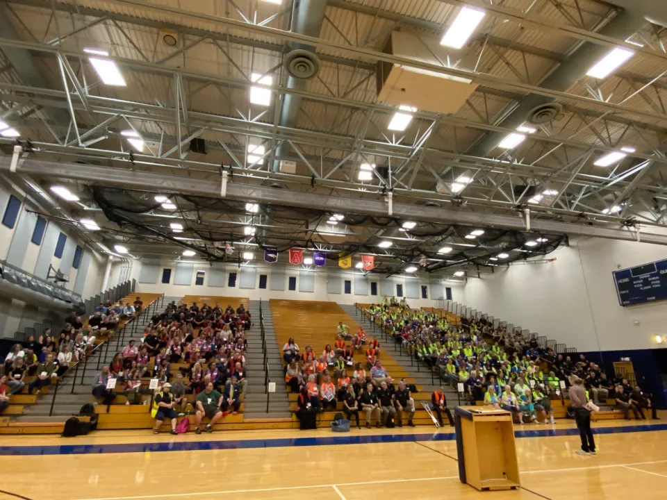 Century high school gymnasium with people in bleachers