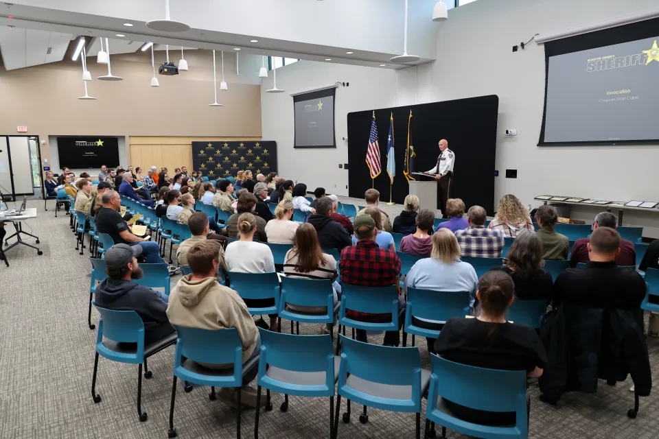 Sheriff Torgerson stands in front of those in attendance and welcomes them to the awards program.