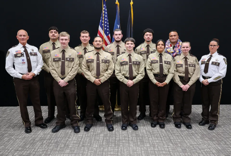 Olmsted County Sheriff's Office Detention Deputies pose for a photo after being publicly sworn in.