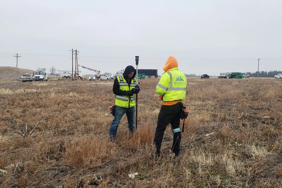 Site surveyors at Haverhill Township solar array site
