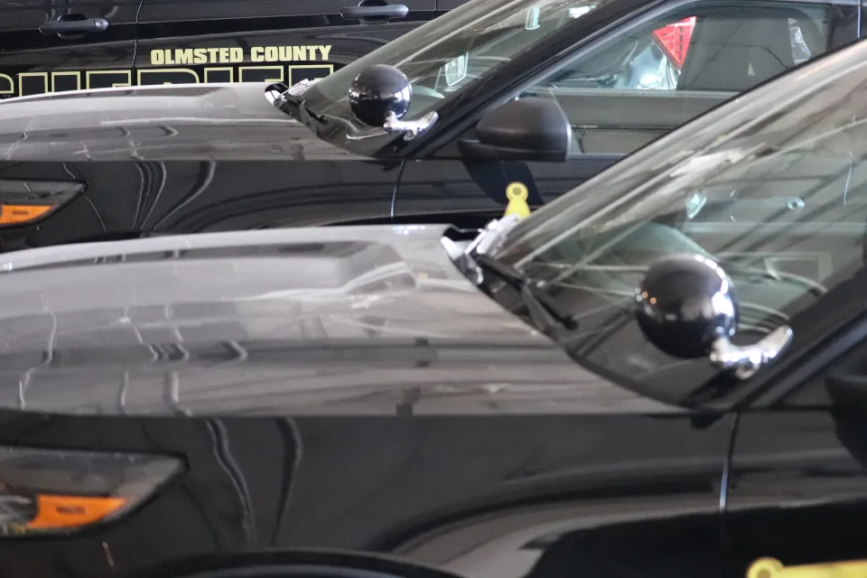 Sheriff's Office Mechanic Working on Squad