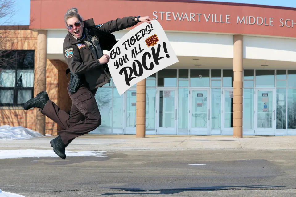Deputy Aviani Torkelson thanking Stewartville schools with a sign