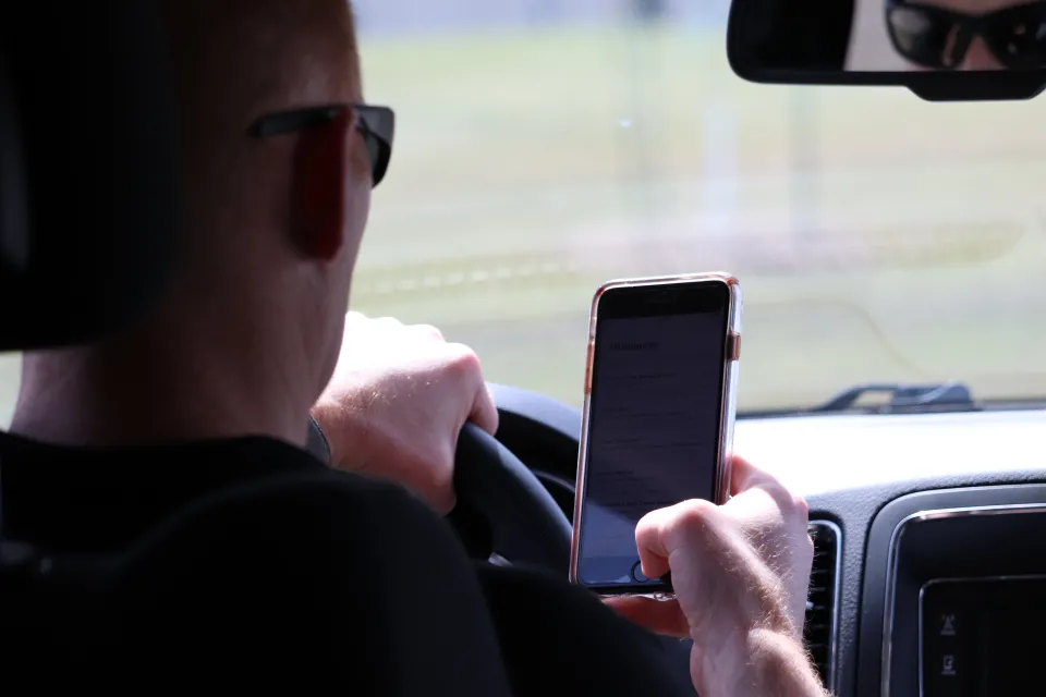 Driver texting on phone