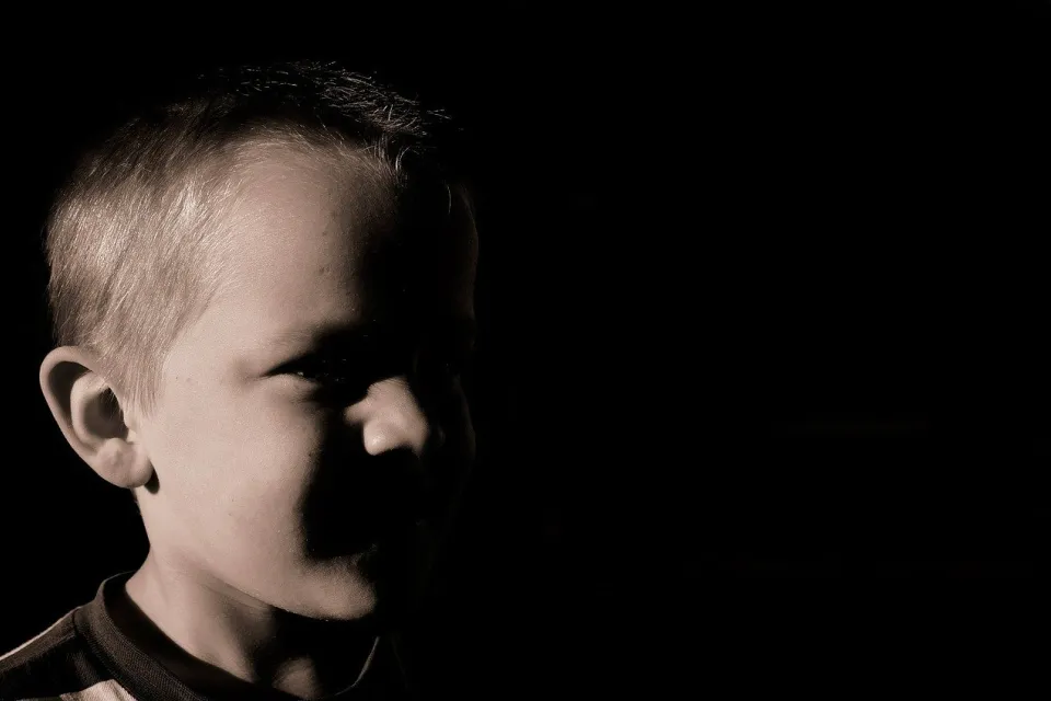 Boy in the shadows