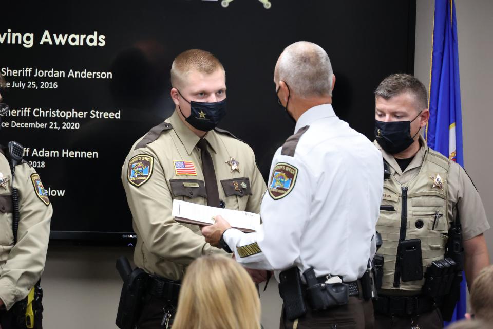 Sheriff Torgerson presents Life Saving Award to Deputy