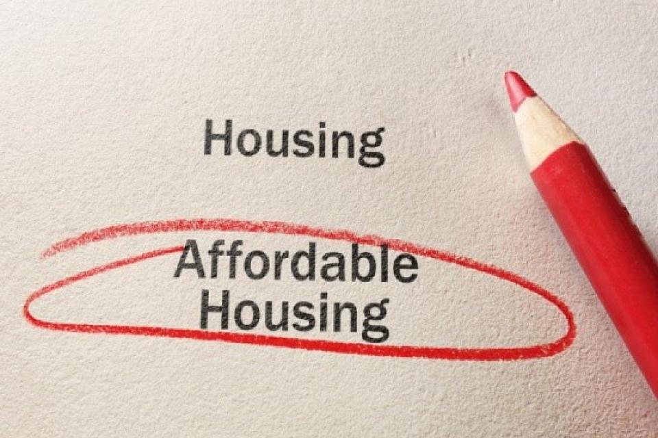 Words housing and Affordable housing, Affordable house is circled with red pencil