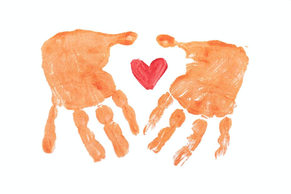 Hand prints with a heart in the middle