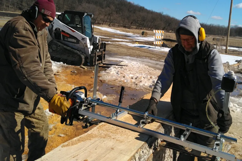 Park staff using Alaskan Mill