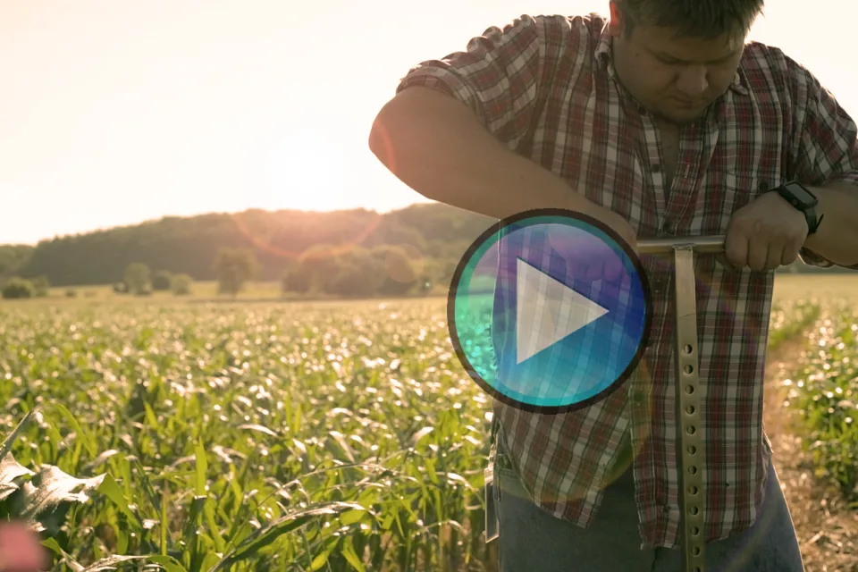 Video still of a man testing soil