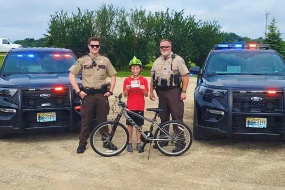 Deputies with bike rider who was wearing helmet