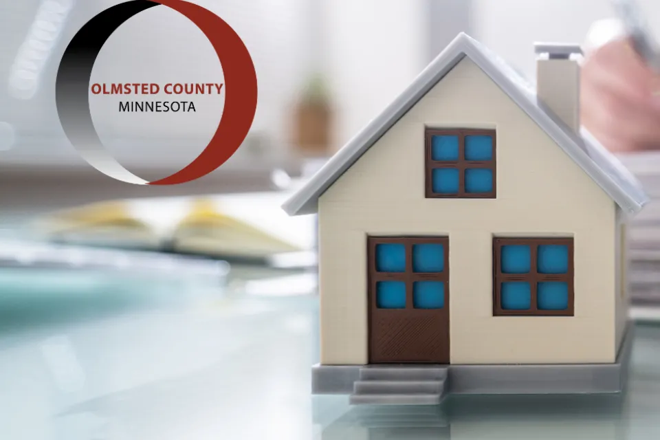 Model of a house with the Olmsted County logo in the upper left corner of the picture.