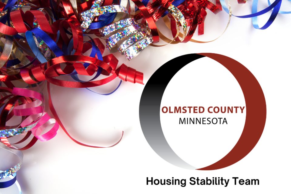 colorful ribbons in the upper left corner of the picture. The Olmsted County, Minnesota logo is in the bottom right corner with "Housing Stability Team" below it.