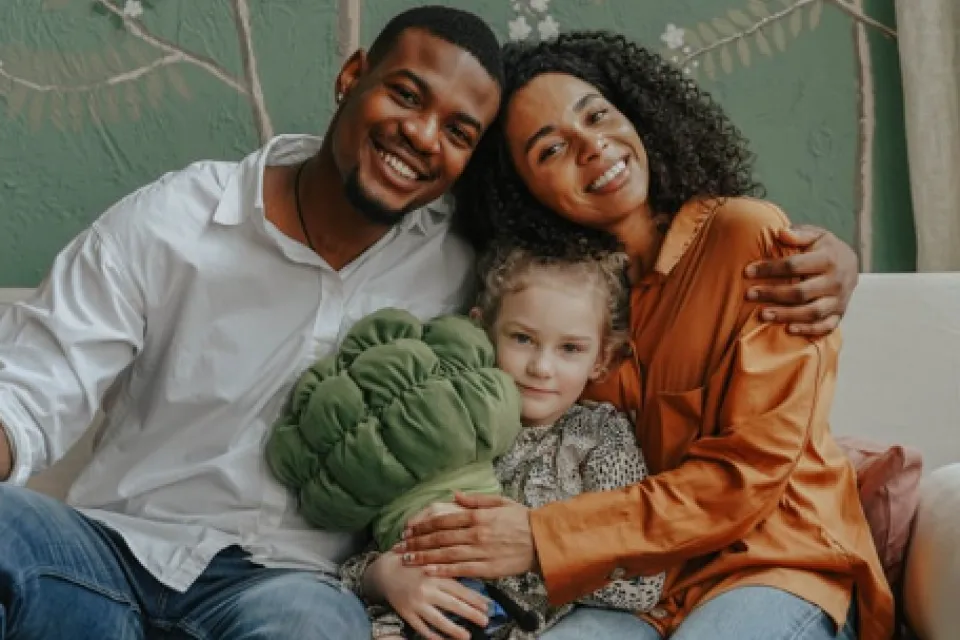 Father, Mother and child hugging