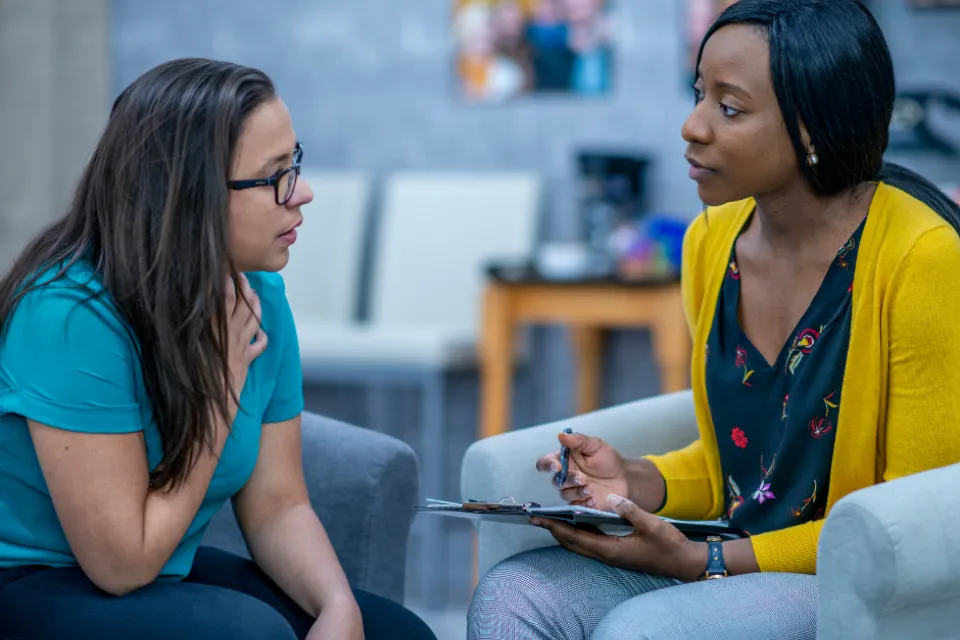 Social worker meeting with a client