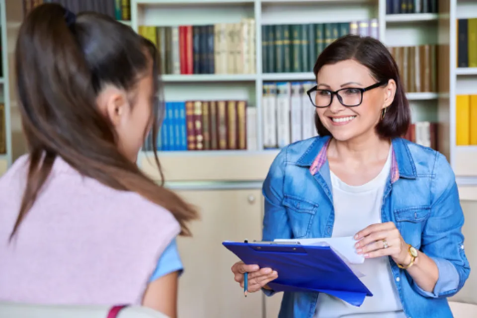 Social worker talking to a teenager